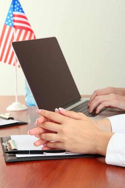 Close-up of hands typing on a laptop, searching for information about unemployment benefits extensions and state unemployment agencies. The image should emphasize the act of research and seeking information.