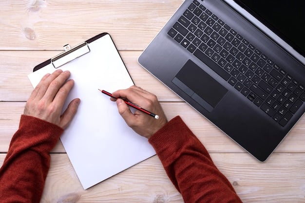 A person filling out an application form on a laptop, with documents and a pen on the table. The scene is well-lit, suggesting a focus on detail and accuracy.