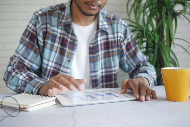A person using a financial planning app on their tablet, showing charts and graphs related to retirement savings and inflation projections.