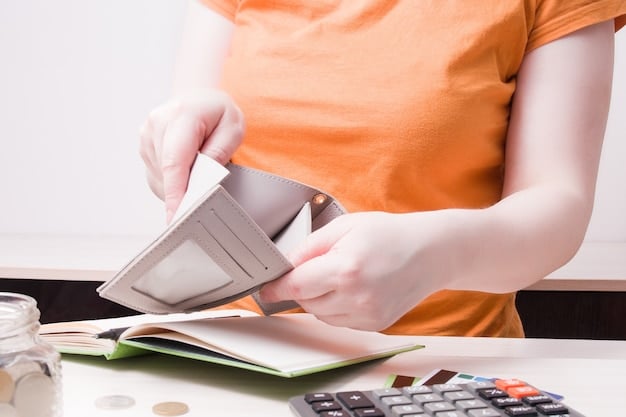 A person cutting coupons and looking at budget planning spreadsheets, symbolizing mindful spending and savings strategies.