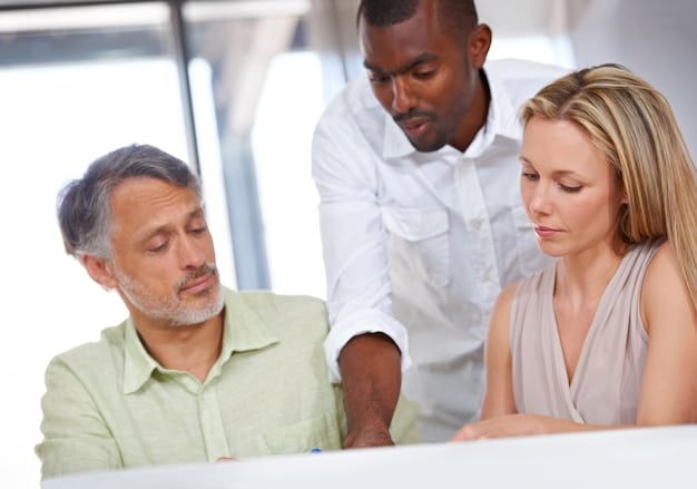 A close-up of a financial advisor explaining different charitable giving options to a couple in a modern office setting.